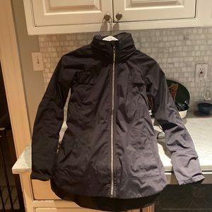 Lululemon mid weight rain jacket with hidden hood.